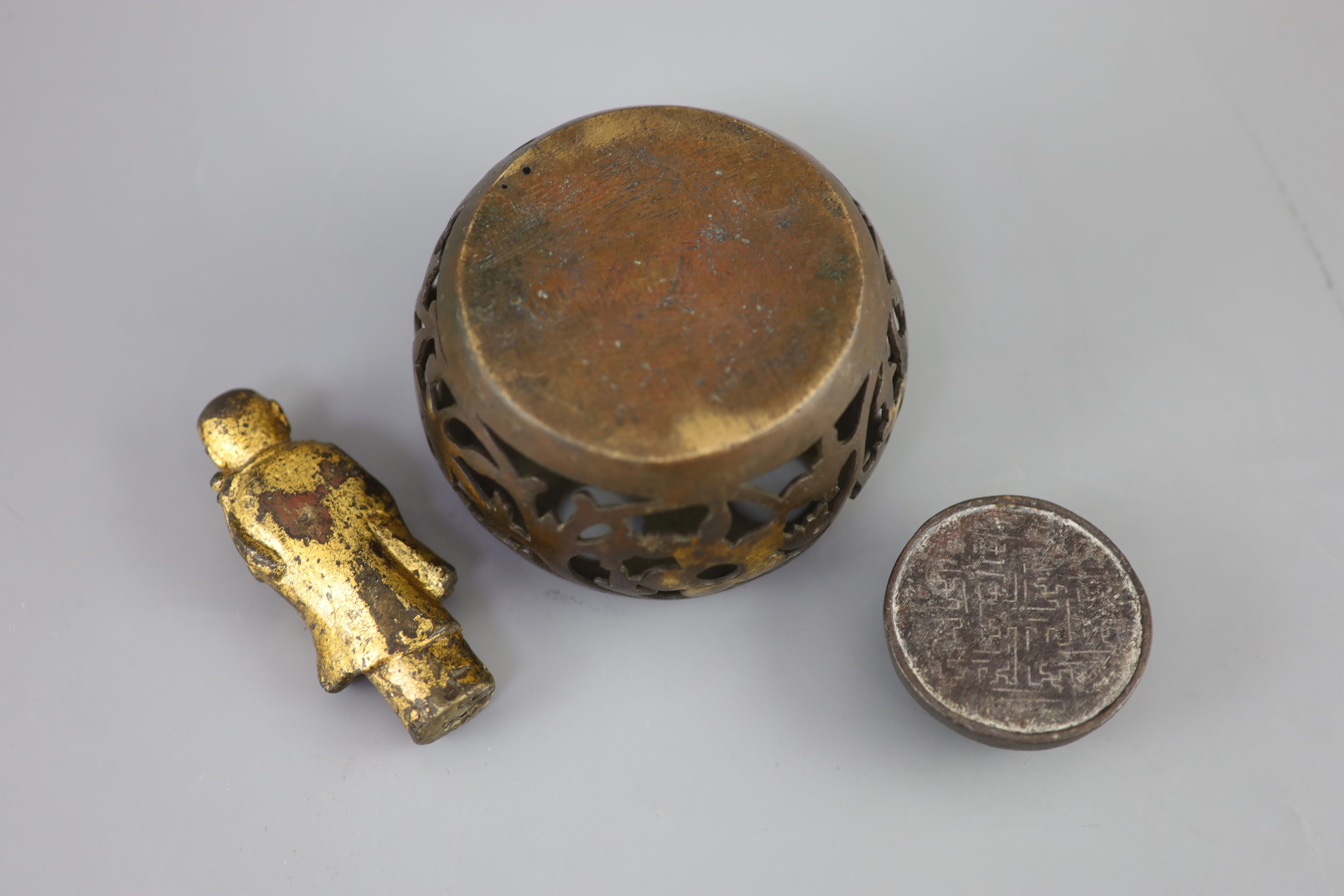 A Chinese bronze drum-shaped stand, a gilt bronze figure of a monk, 17th/18th century and a silver and gold inlaid iron waterpot, Qing,